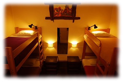 3 Beds in Private Room<br><br>First floor private dormitory with 2 bunk beds and shared bathroom.<br><br><small>Includes personal lamps, personal security lockers, a mirror, a fan, towels, sheets, pillows and extra blankets.<br>(Click on the picture)</small>